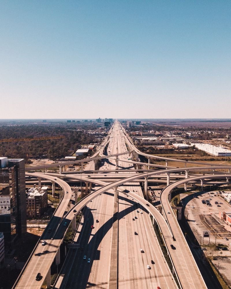 Aerial view of a Houston highway interchange with freight lanes